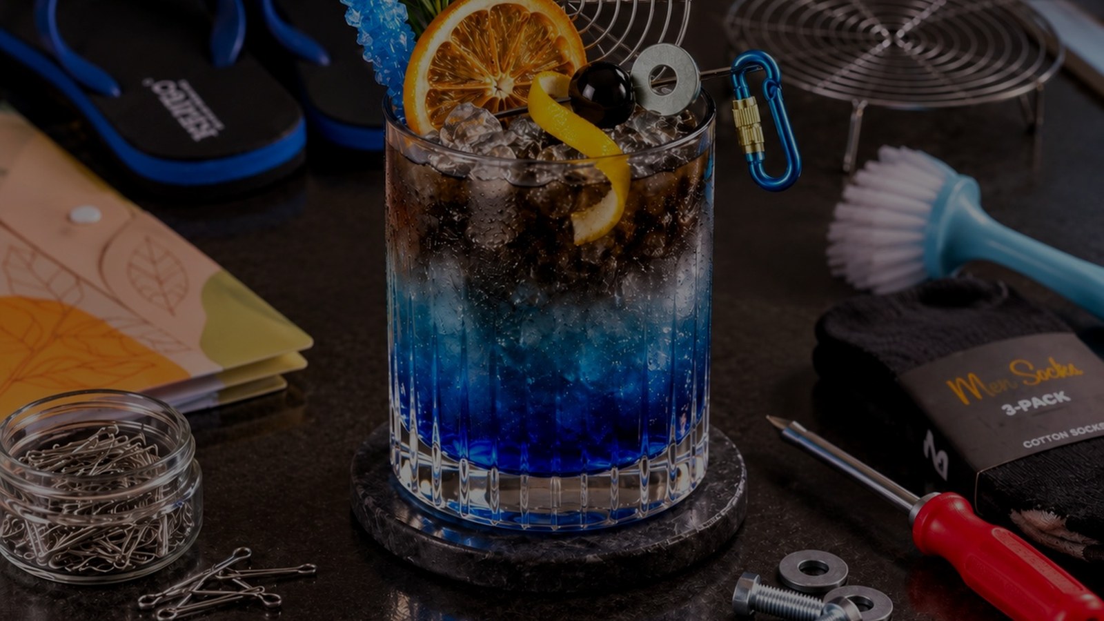 Close-up of the blue Toffel Tonic and its decorative photo props